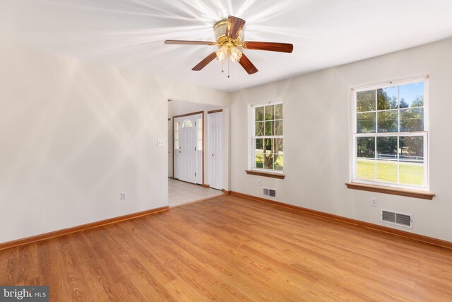 unfurnished room featuring ceiling fan and light wood-type flooring