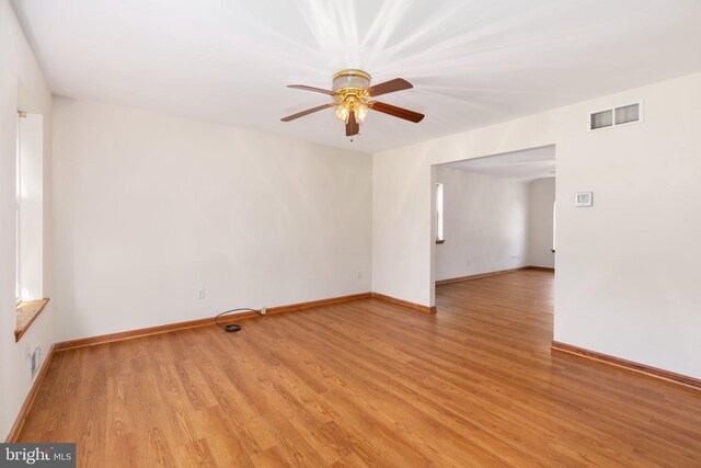 spare room featuring light hardwood / wood-style flooring and ceiling fan