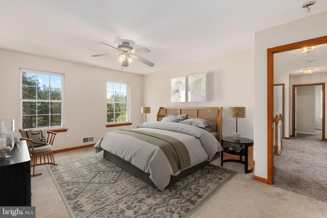 carpeted bedroom featuring ceiling fan