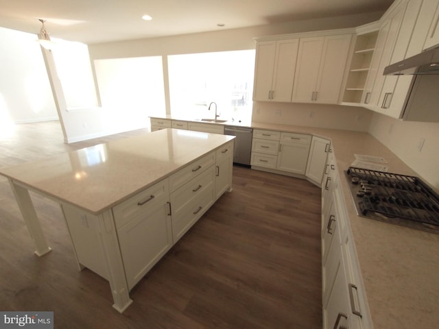 kitchen featuring white cabinetry, dishwasher, and a kitchen island