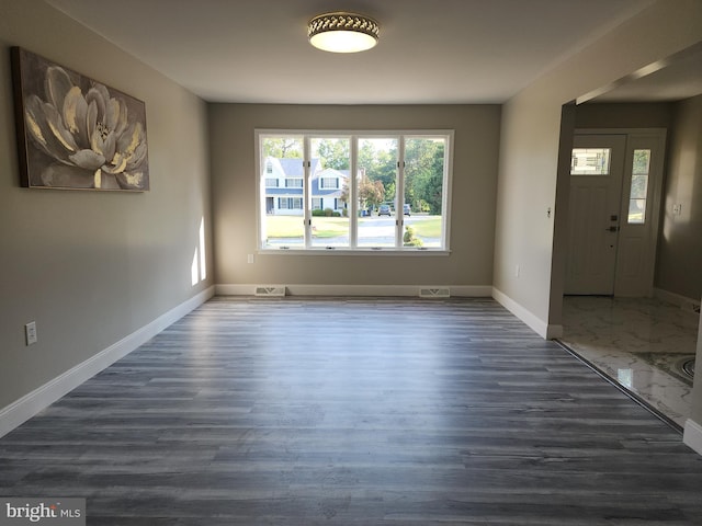 entrance foyer with dark hardwood / wood-style flooring