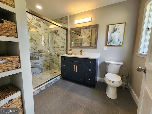 bathroom featuring walk in shower, vanity, tile patterned flooring, and toilet