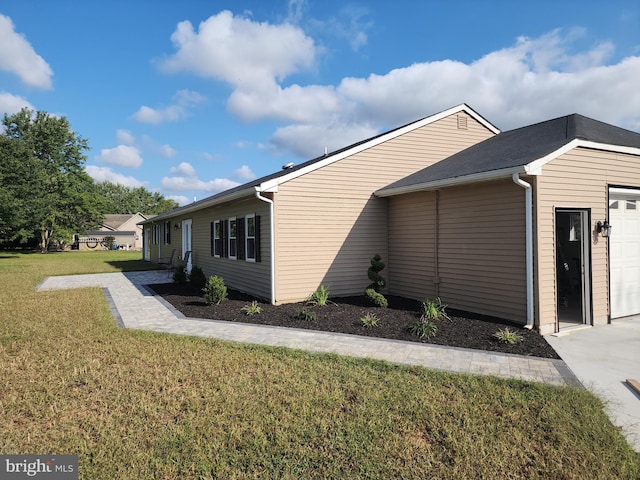 view of home's exterior featuring a lawn