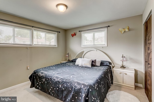 carpeted bedroom with a closet