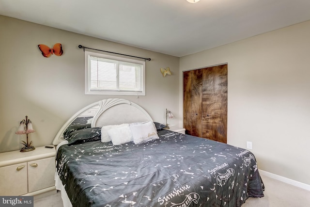 carpeted bedroom with a closet