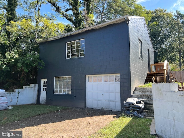 view of property exterior with a garage