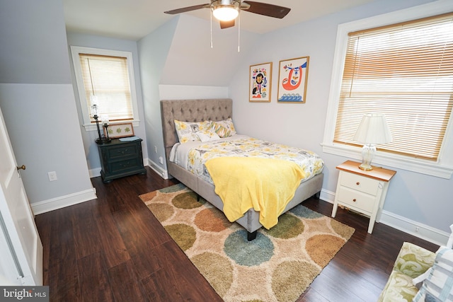 bedroom with dark hardwood / wood-style flooring and ceiling fan