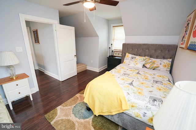 bedroom featuring lofted ceiling, dark wood-type flooring, and ceiling fan