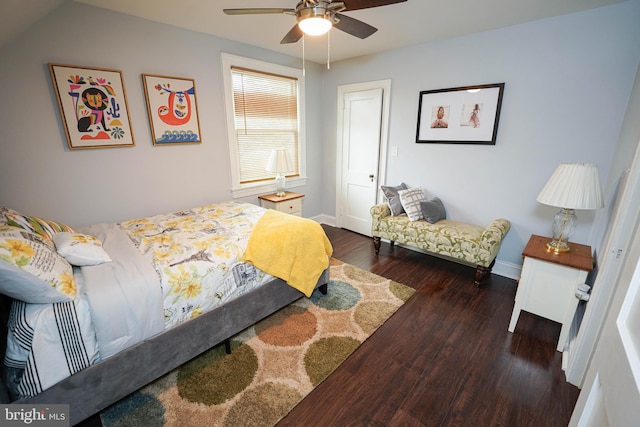 bedroom with lofted ceiling, dark hardwood / wood-style flooring, and ceiling fan