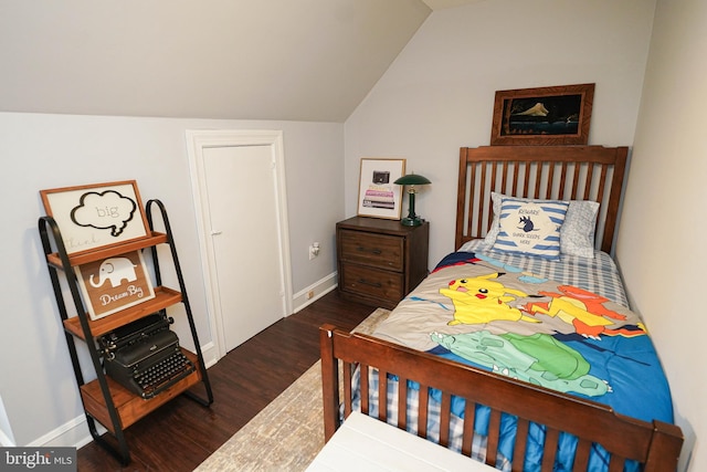 bedroom with lofted ceiling and dark hardwood / wood-style flooring