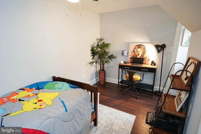 bedroom with dark wood-type flooring