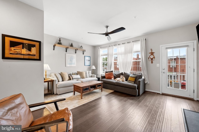 living room featuring a wealth of natural light, ceiling fan, and hardwood / wood-style flooring