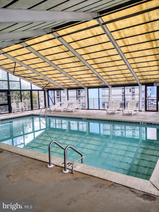 view of swimming pool featuring a patio area