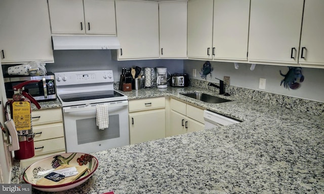 kitchen with light stone counters, exhaust hood, sink, and white appliances