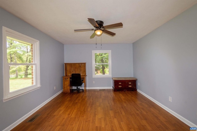 unfurnished living room featuring ceiling fan, plenty of natural light, and hardwood / wood-style floors