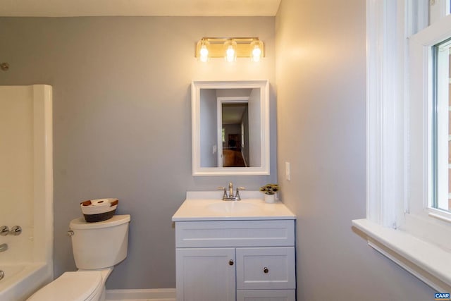 full bathroom featuring shower / bathing tub combination, vanity, and toilet