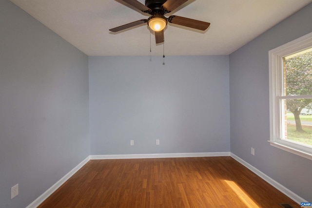 spare room with ceiling fan and wood-type flooring