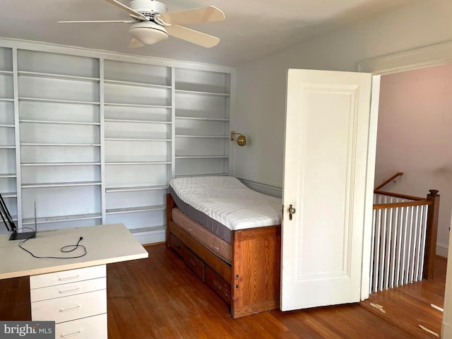 unfurnished bedroom featuring ceiling fan and dark hardwood / wood-style flooring