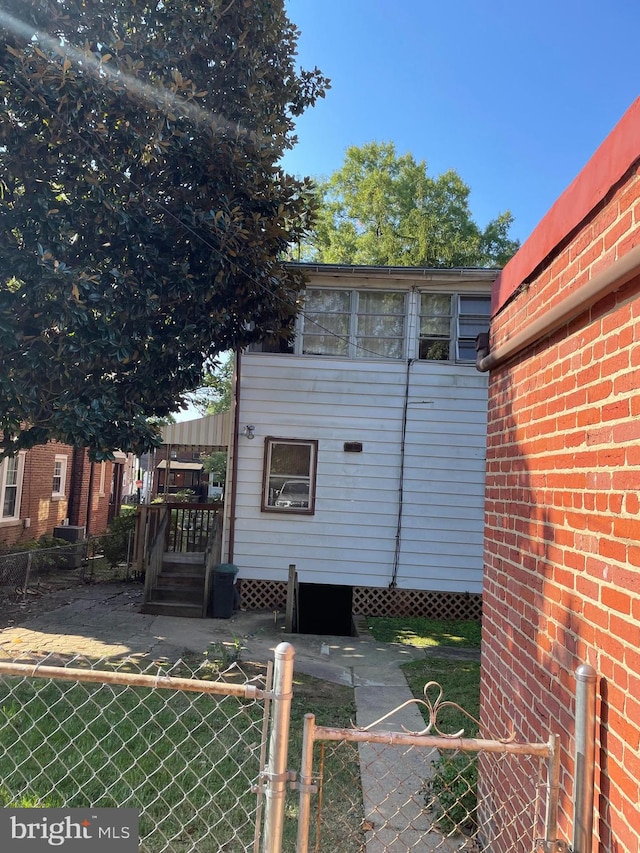 view of home's exterior featuring a lawn