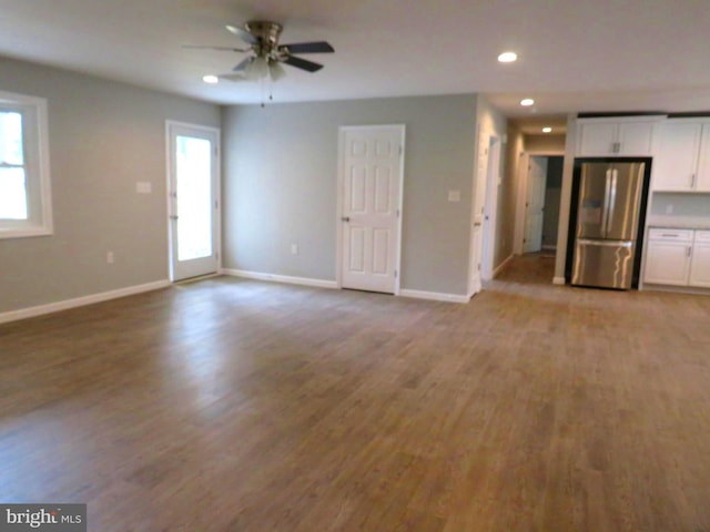 unfurnished living room with light hardwood / wood-style floors and ceiling fan