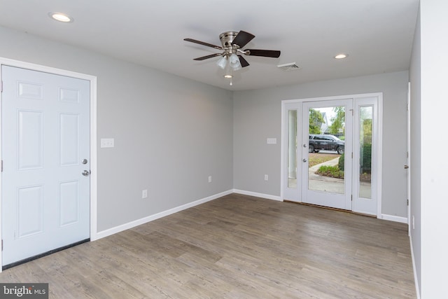 entryway featuring light wood-type flooring and ceiling fan