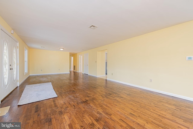 empty room with wood-type flooring