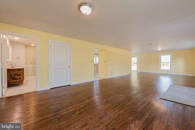 spare room featuring dark hardwood / wood-style floors