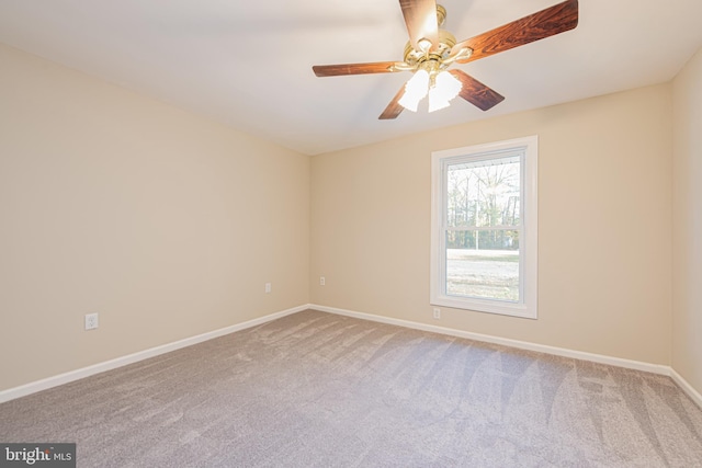 spare room with ceiling fan and carpet floors