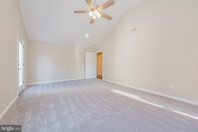 spare room with ceiling fan, a healthy amount of sunlight, and light carpet