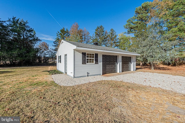 garage with a lawn