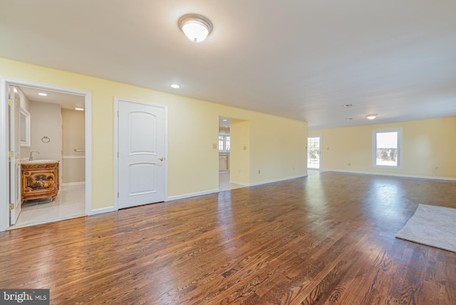 unfurnished room featuring hardwood / wood-style flooring