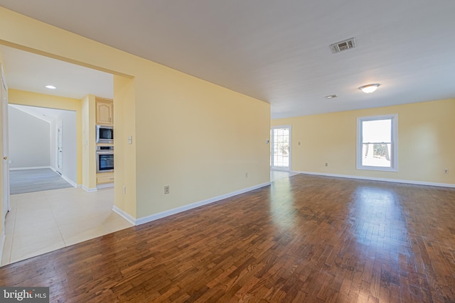 unfurnished room with light hardwood / wood-style floors