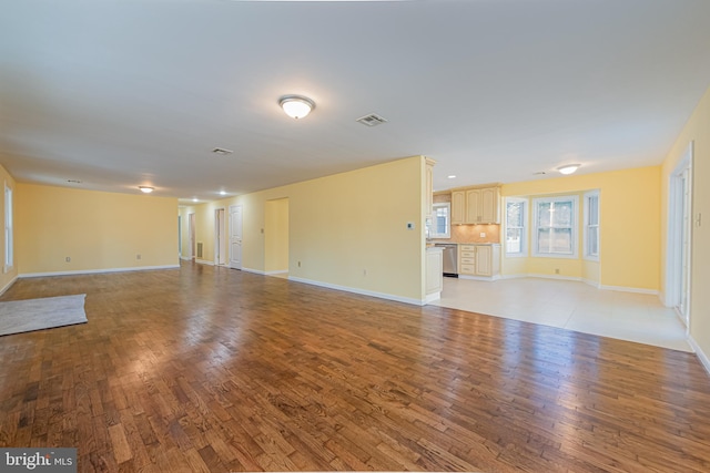 unfurnished living room featuring light hardwood / wood-style floors