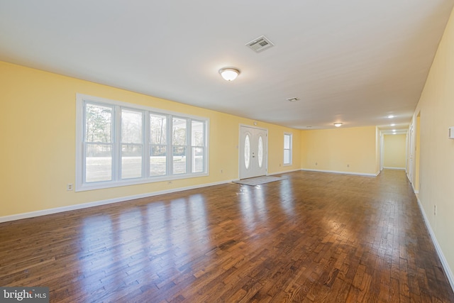 spare room featuring dark wood-type flooring