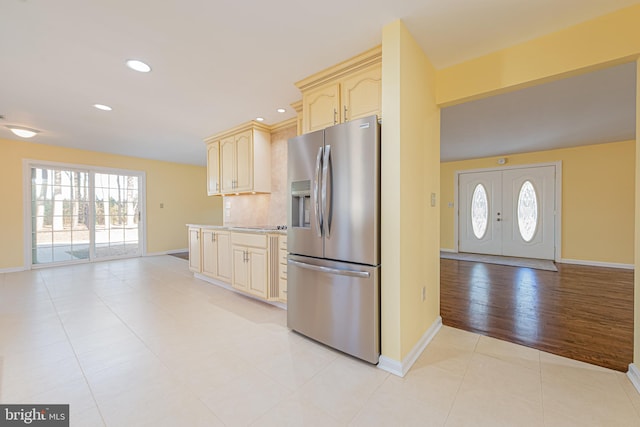 kitchen featuring stainless steel refrigerator with ice dispenser, light hardwood / wood-style floors, and plenty of natural light