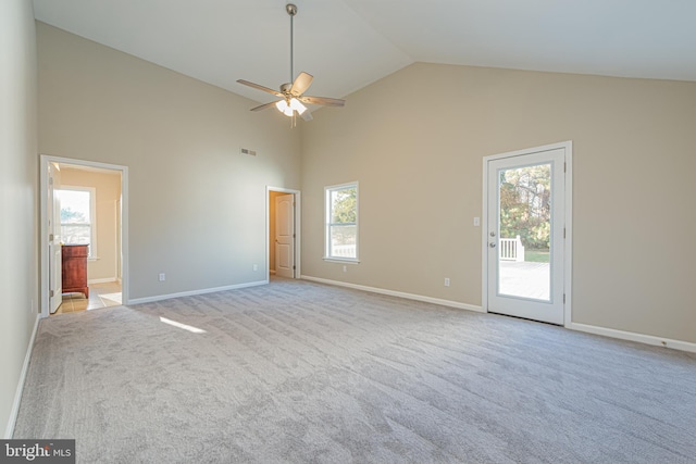 unfurnished room with ceiling fan, light carpet, and a healthy amount of sunlight