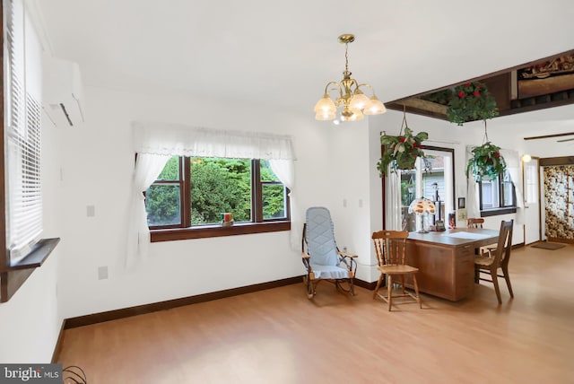 650 Bucks Church Rd, Newport, PA 17074 - dining area with wood finished floors, a chandelier, and baseboards