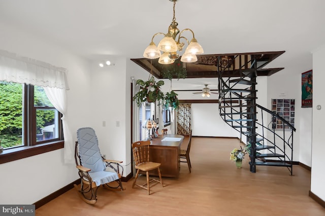650 Bucks Church Rd, Newport, PA 17074 - dining area with a chandelier, stairs, a ceiling fan, baseboards, and wood finished floors