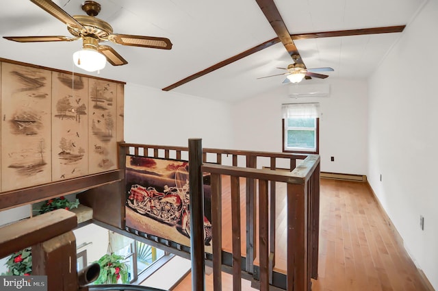 650 Bucks Church Rd, Newport, PA 17074 - stairway featuring a ceiling fan, wood finished floors, baseboards, a wall mounted air conditioner, and a baseboard heating unit