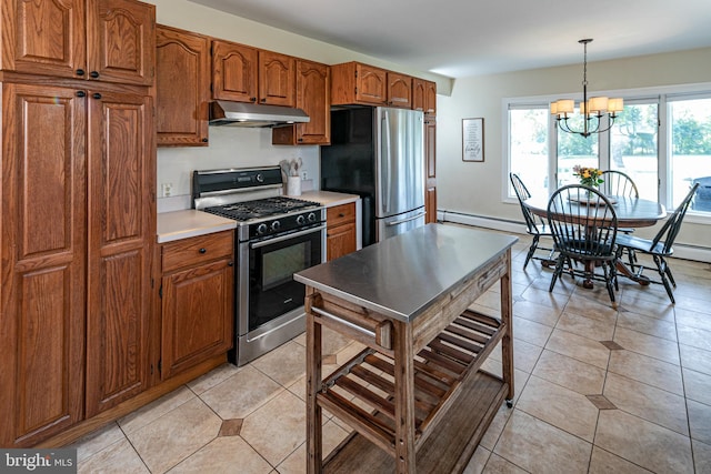 kitchen featuring stainless steel appliances, pendant lighting, light tile patterned flooring, and a notable chandelier