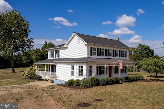 view of front of home featuring a porch and a front yard