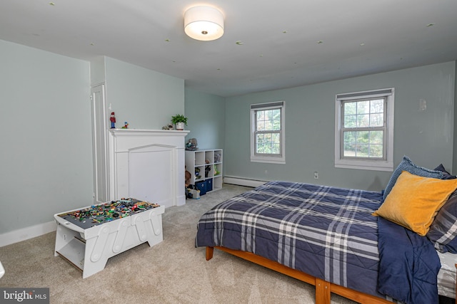 bedroom featuring light carpet and baseboard heating