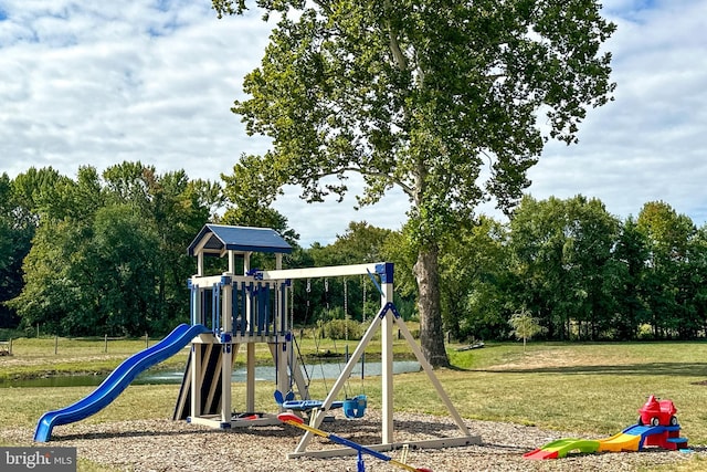 view of playground with a lawn