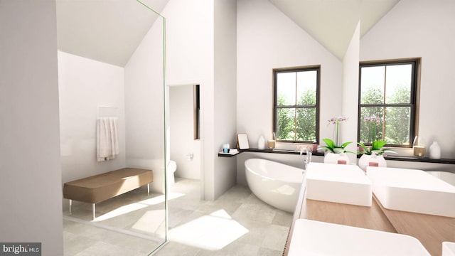 bathroom featuring toilet, a bath, and high vaulted ceiling