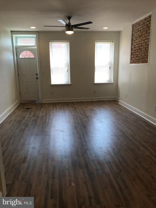 entrance foyer with ceiling fan and dark hardwood / wood-style flooring