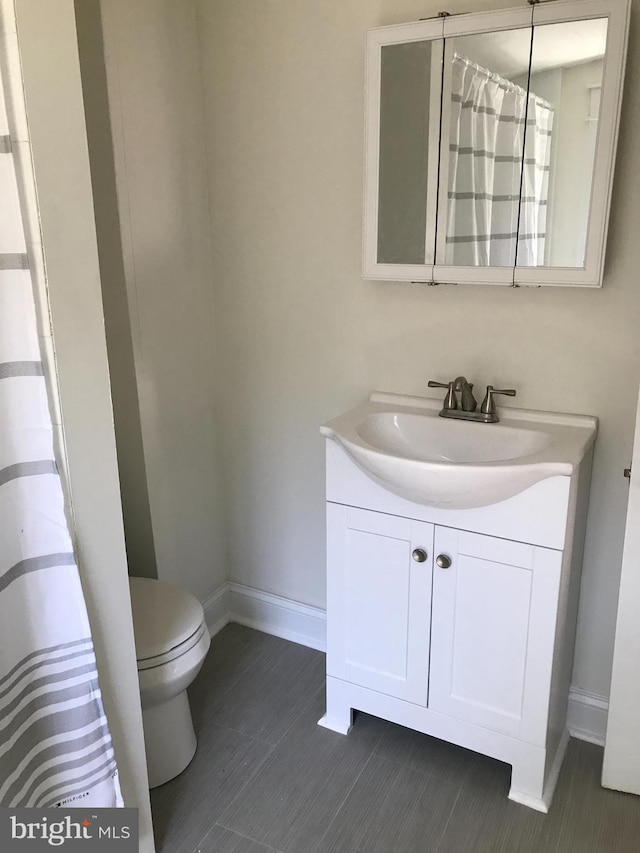 bathroom with vanity and toilet