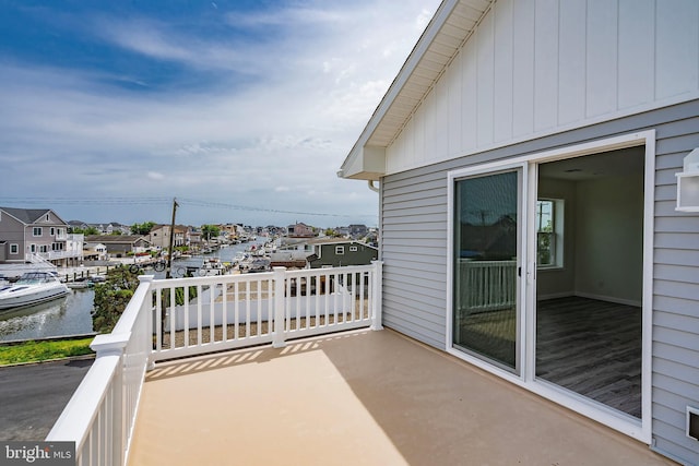 balcony featuring a water view