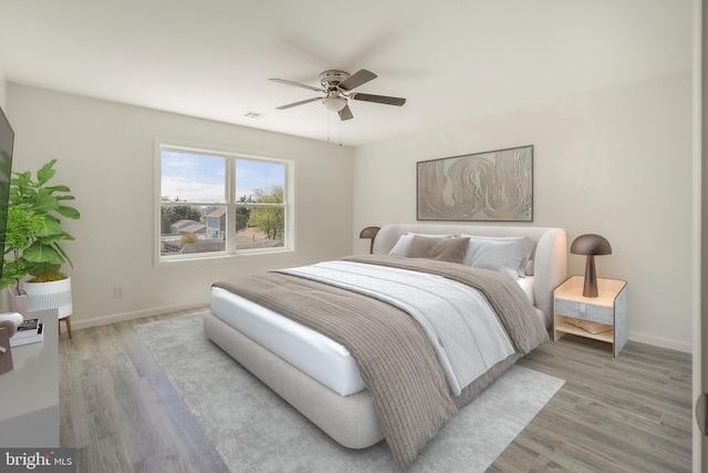 bedroom featuring wood-type flooring and ceiling fan