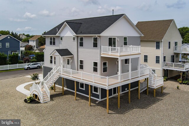 rear view of house featuring a balcony