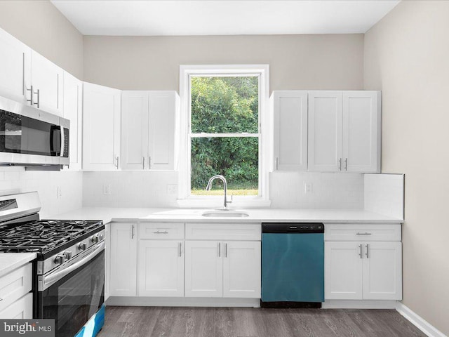 kitchen with stainless steel appliances and white cabinetry